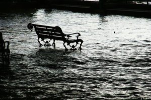 Flooded street with bench